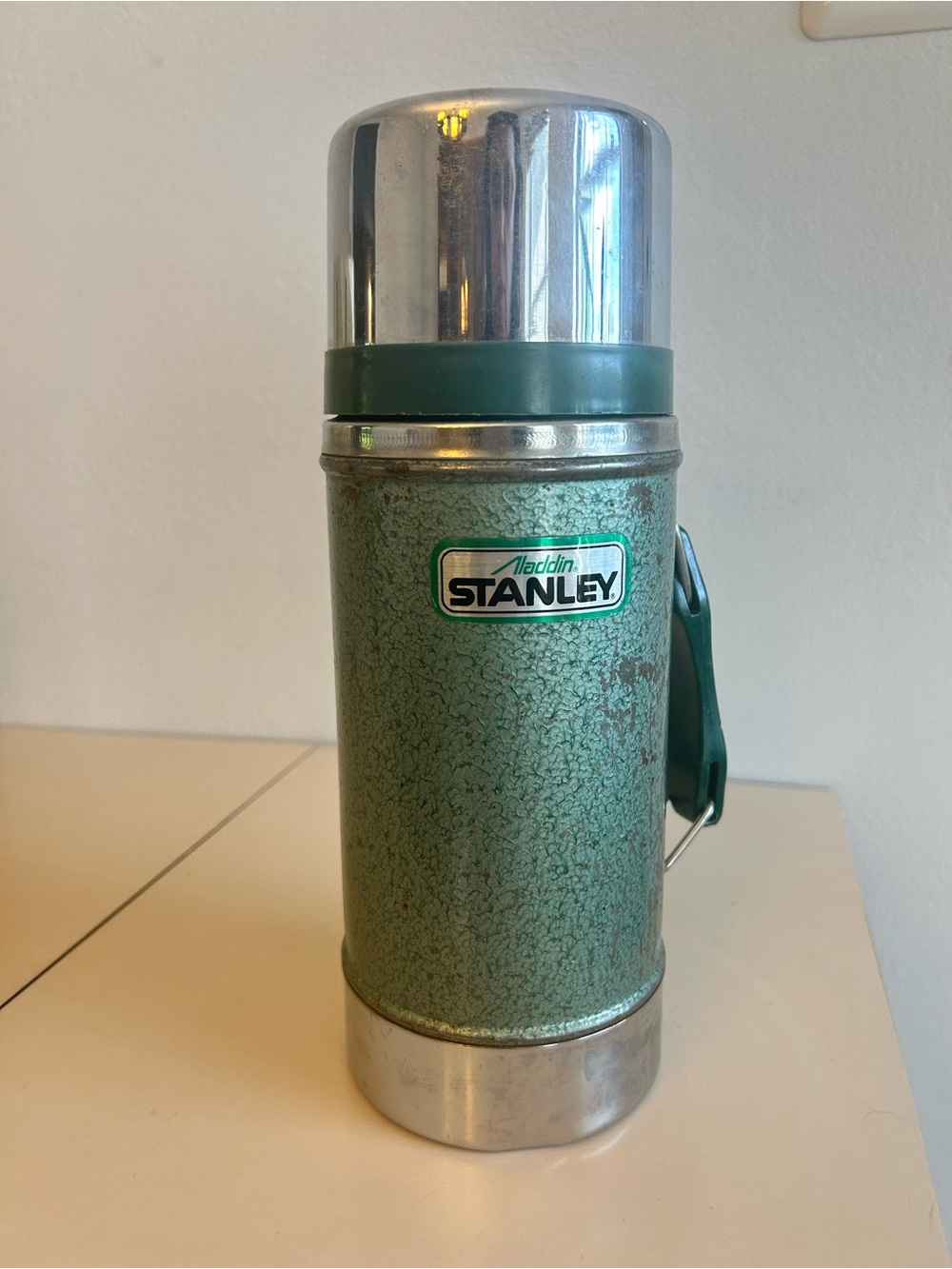 Aladdin Stanley Green Hammertone Insulated Container with a chrome cup.
